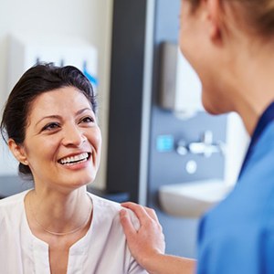 Dentist in Parma talking to patient about cosmetic dental treatment